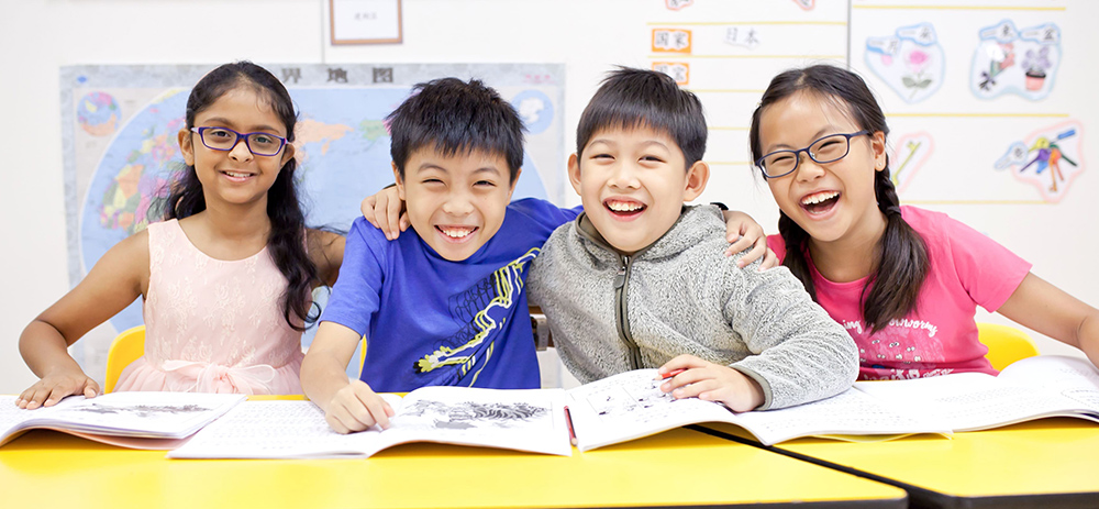 A-group-of-students-sitting-at-a-table-immersed-in-their-books-highlighting-the-joy-of-reading-together---Chengzhu-Mandarin-Centre